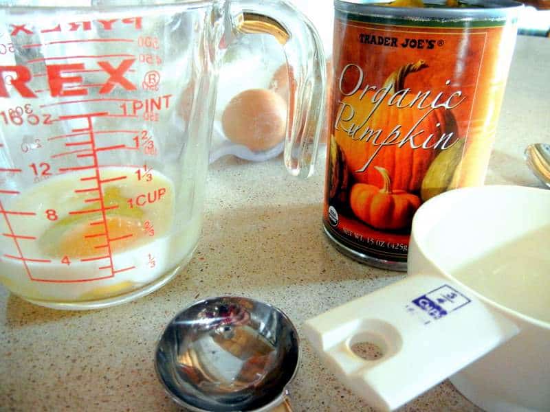 Adding in the organic pumpkin, milk and egg.