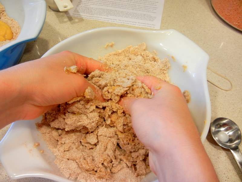 Mixing the flour into the spices and cutting in the butter.