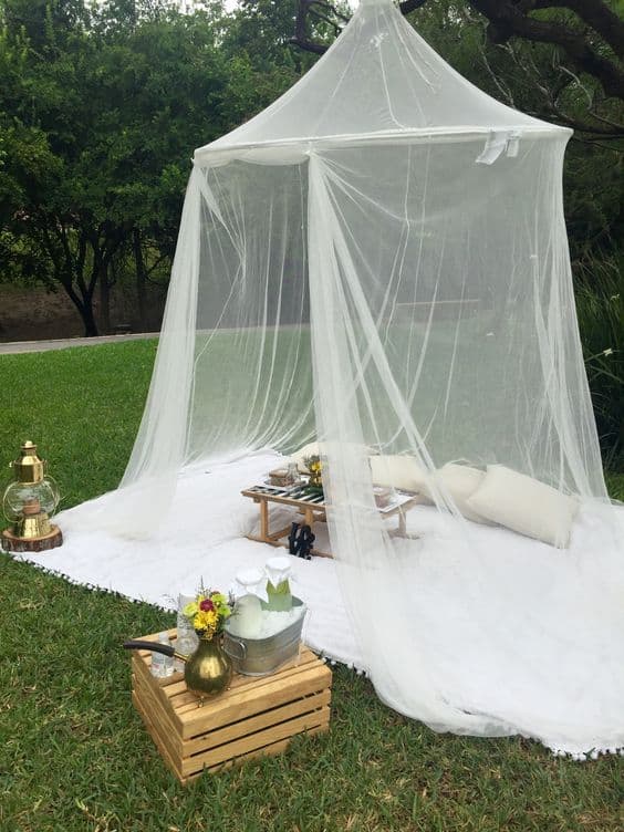 Creating Whimsy In Your Backyard & Garden, Part Two mosquito netting over an outdoor conversation area