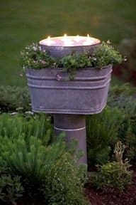 Creating Whimsy In Your Backyard & Garden, Part Two. Pathway lights out of an old washtub with candles in garden