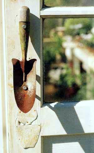A shabby chic door pull made out of a trowel 