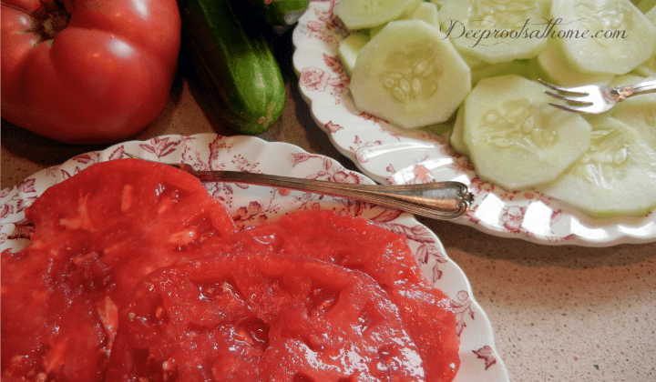 6 Tomato Health Benefits & Essential Summer Foods To Pair with Them. A plate of tomatoes and cucumbers freshly sliced.