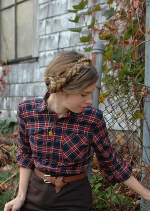 Around The House With Class: A Portrait Of Feminine Dress. A woman with a beautiful braided circlet in hair with a plaid shirt