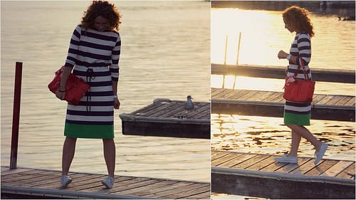 In deck shoes and striped cotton boat-neck dress, out on the lake