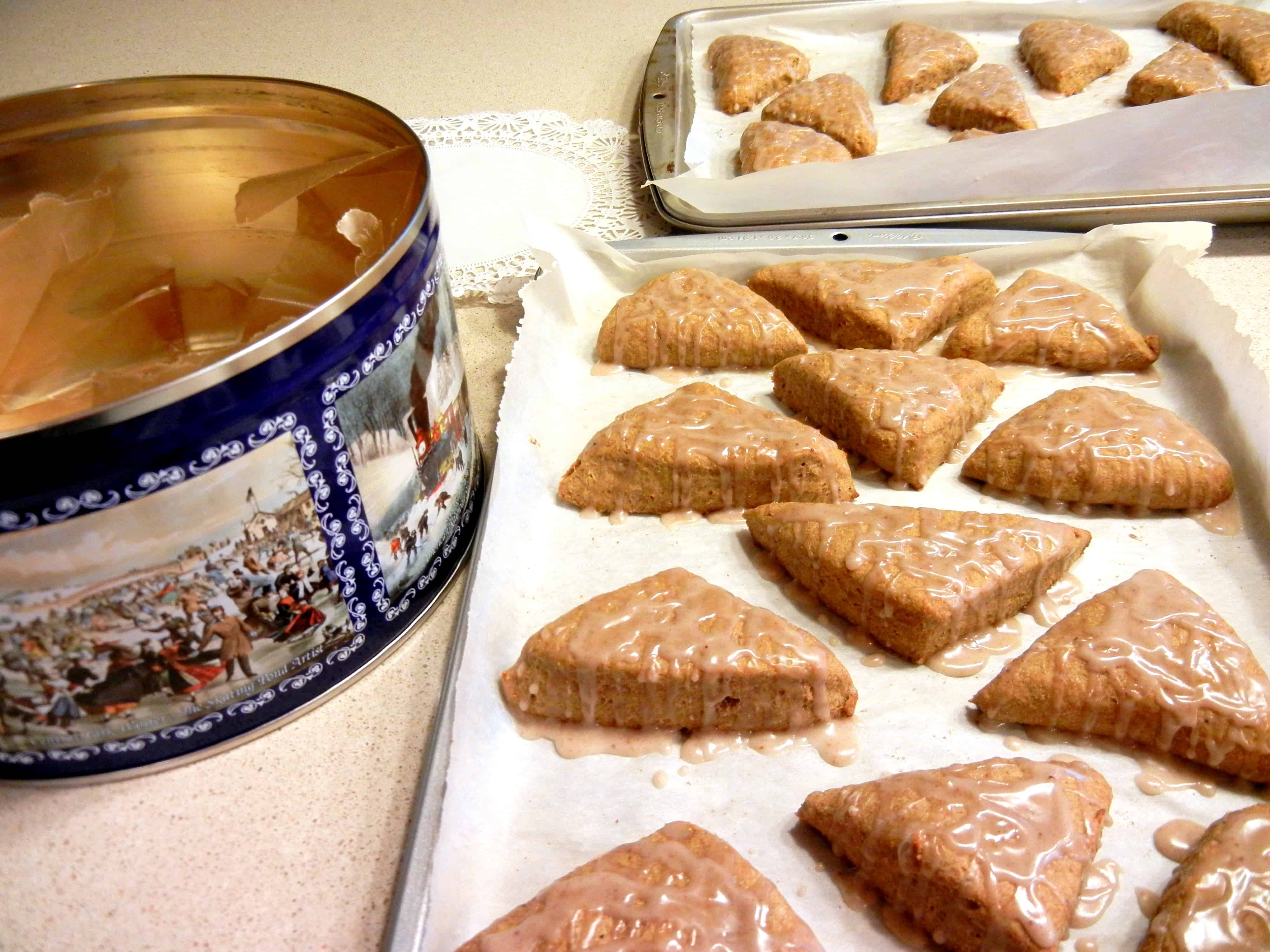 Better-Than-Starbuck's Pumpkin Scones Recipe and Tutorial. Baking trays full of warm baked scone with glaze puddles.