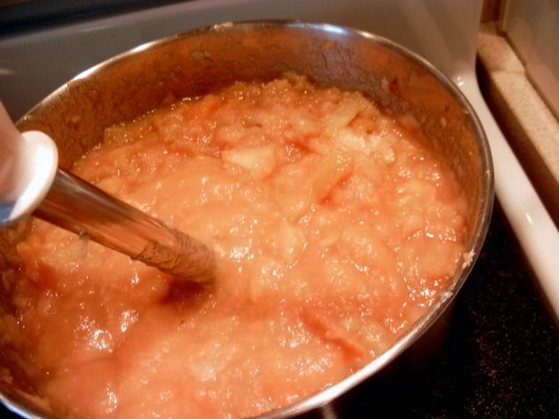 using stainless steel stick blender to puree into apple butter