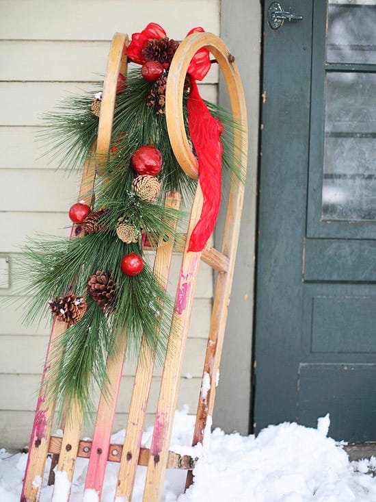 Simply Classic & Timeless Natural Holiday Decorations. A sleigh with greenery, ribbons