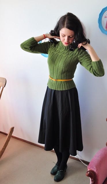 woolen sweater, tiny belt and flared loden skirt