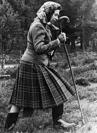  a young Queen Elizabeth hiking in a plaid kilt skirt