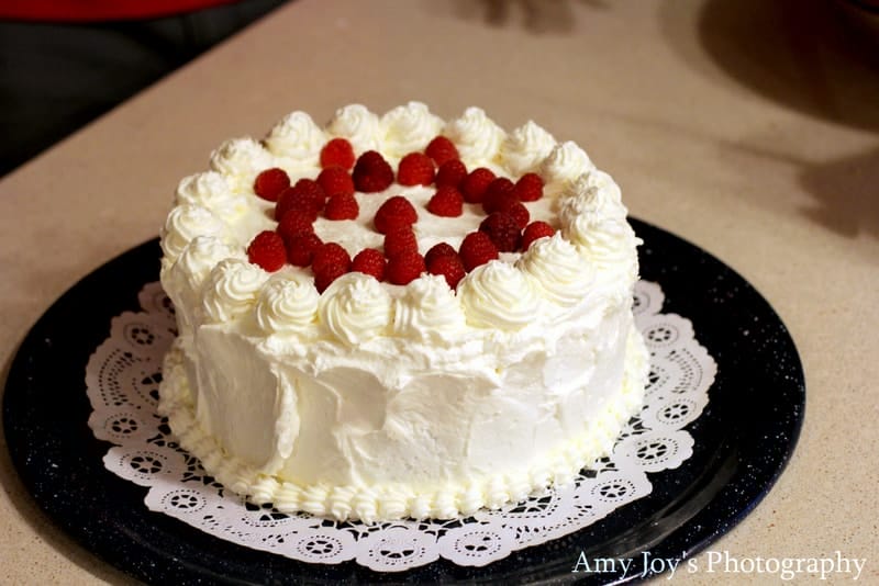 White Chocolate Raspberry Torte Recipe & Tutorial. The finished white chocolate raspberry torte on doily