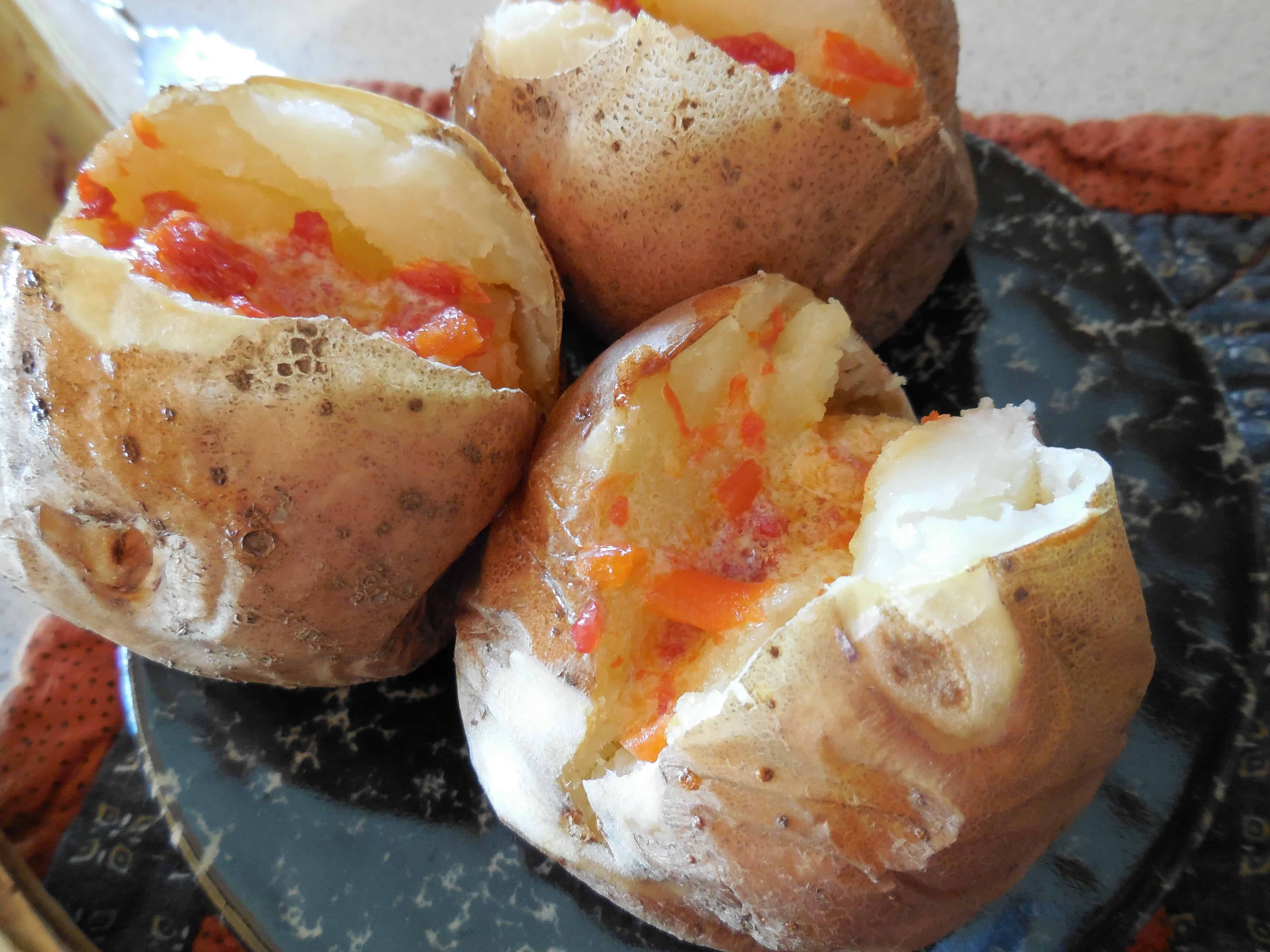Roasted Red Pepper Butter Recipe: Comfort Food, Easy, Ketogenic. Image of it melting on baked potatoes.