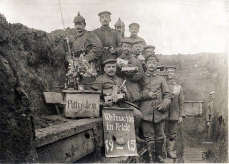 The World War I Christmas Truce: 100 Years Later. Men with a small Christmas tree in the trenches