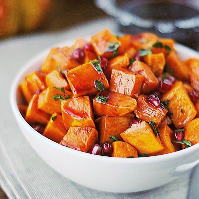 29 Festive Pomegranate Recipes & De-Seeding Video. Roasted Sweet Potatoes with Spiced Pomegranate Molasses {That's Some Good Cookin'}