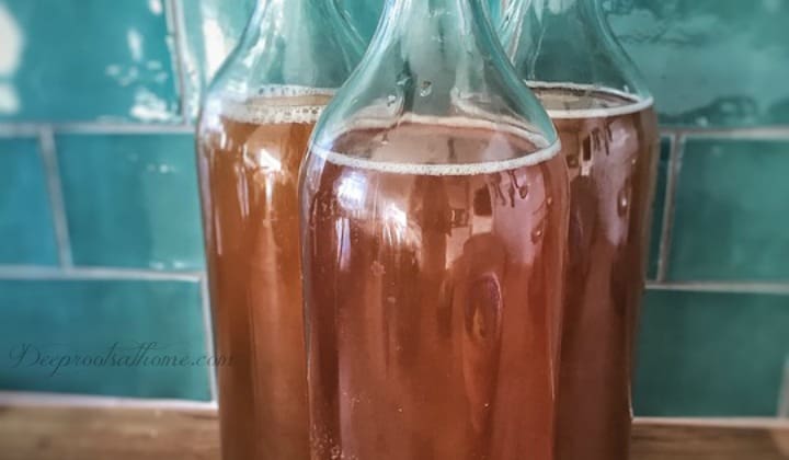 A Complete Beginner's Guide To Brewing Your Own Kombucha. 3 bottles of kombucha ready to refrigerate.