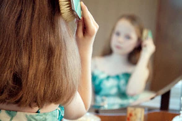 Plastics Messin' With The Hormones Of Our Children? brushing hair, young girl