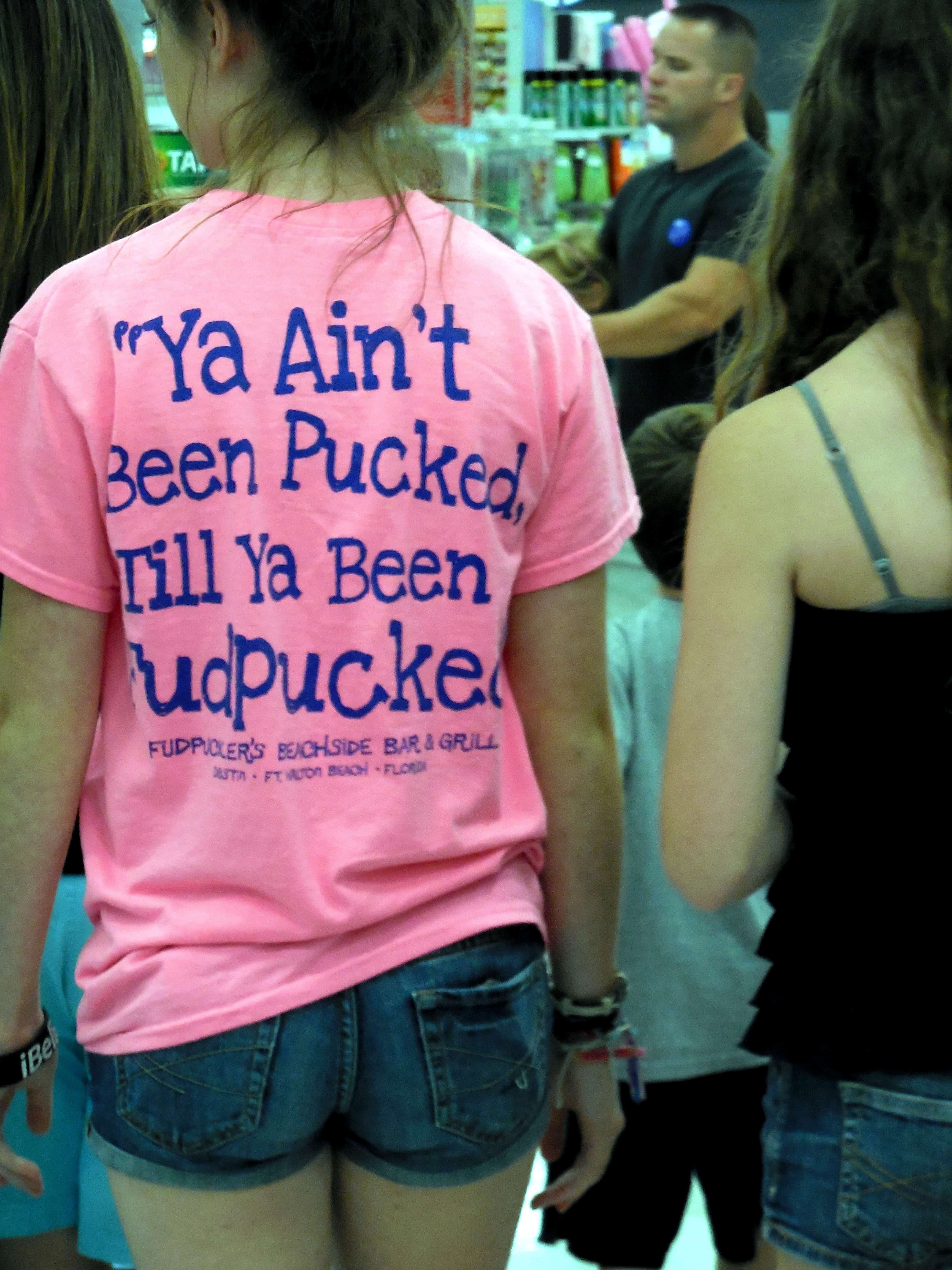 Why Are We Obsessed With Sexing Up Our Children? A young woman in a tee with provocative words