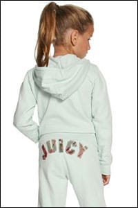 A young girl in sweats with the word 'juicy' on her bottom