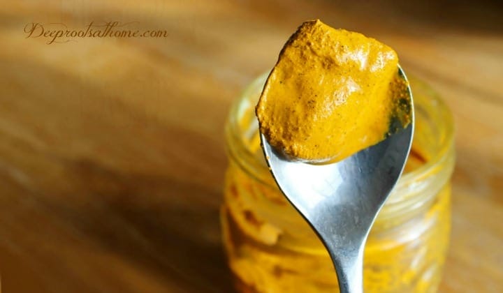turmeric golden paste on a teaspoon