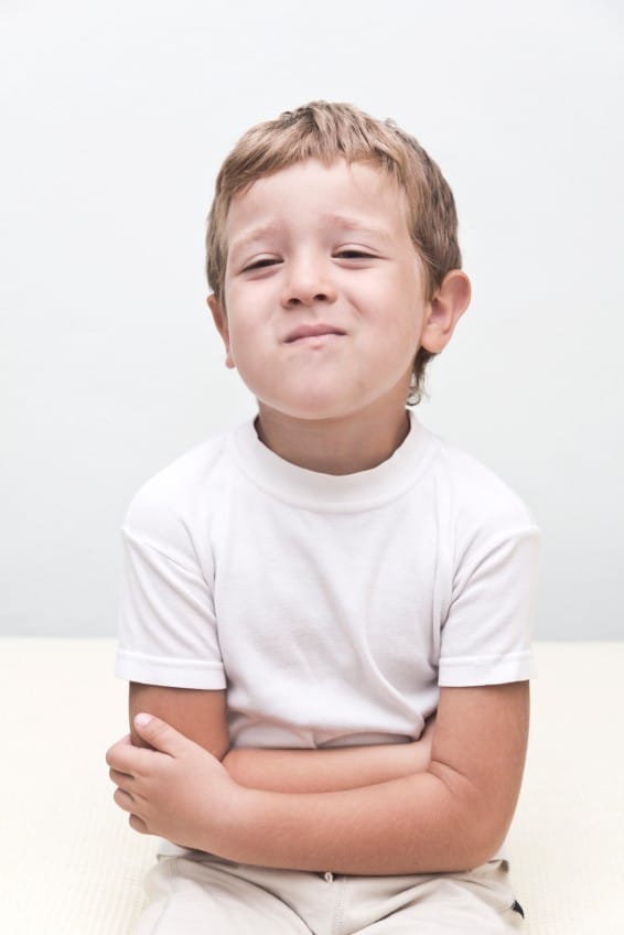 Rethink Medicating: Help Kid's Focus, Sensory, or Behavioral Issues A handsome young boy with a stomach ache