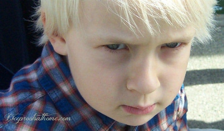 Anger, Aggression, Depression? Identifying Corn In Food. A very sullen, angry young boy.