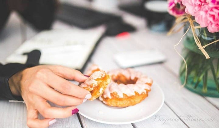 Sugar Cravings & How To Quash Them Effectively With Homeopathy Sugar Cravings & How To Quash Them Effectively With Homeopathy. woman with a donut in hand