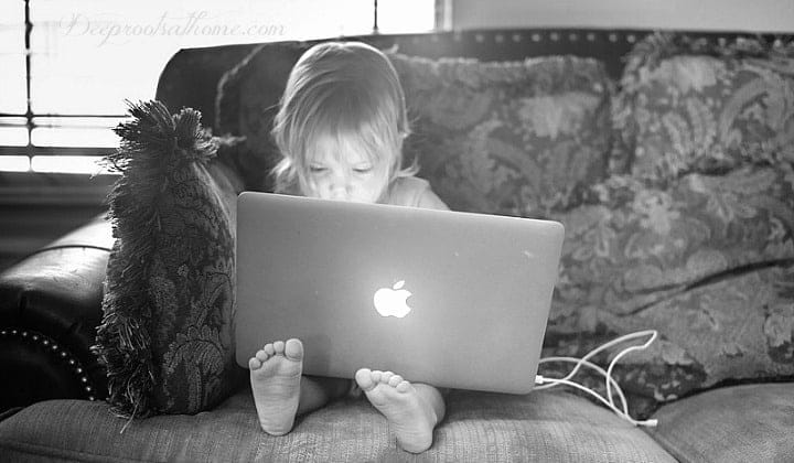 Child Harm, the Silent Tragedy: Every Parent who Cares Should Read This. A young child engrossed in a laptop device