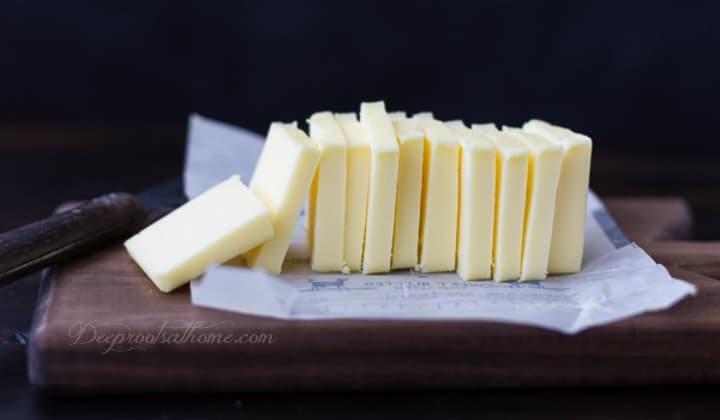 pats of yellow of butter on counter