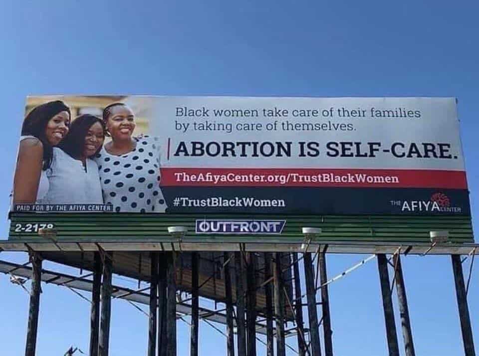 Self Love /Self Care: A Many-Faced Culture: A Young Woman's Warning. A sign in Dallas, TX, for abortion saying "Abortion is Self-Care" .