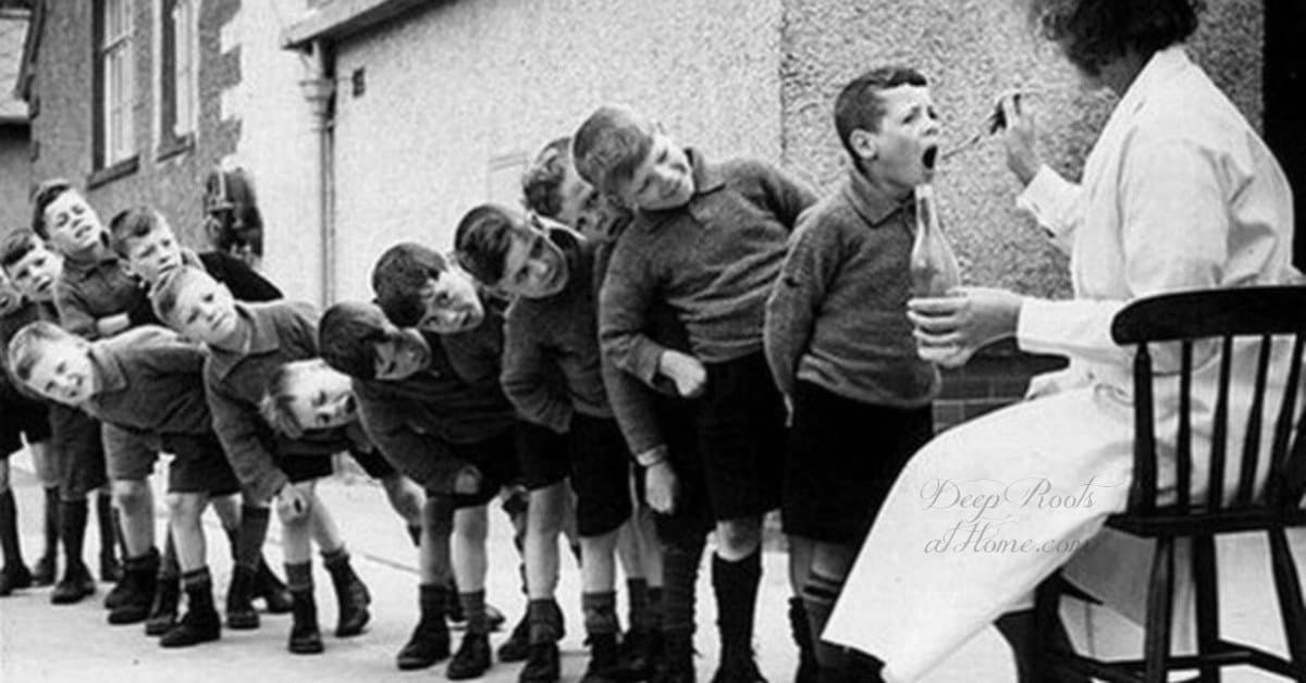 Fish or Cold Liver Oil Can Help Brain Processing Disorders, ADHD Old photo of school boys in Europe lined up, taking CLO.
