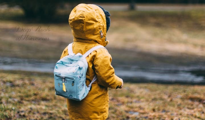 9 Unexpected Things Learned In Healing My Child from ADHD & Anxiety 9 Unexpected Things Learned In Healing My Child from ADHD & Anxiety. A young child in a yellow parka with a little backpack on his back walking towards a river.