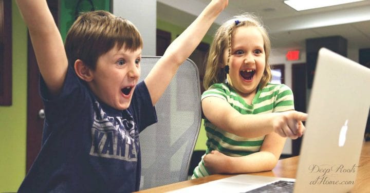 How To Unspoil a Child Who's Had Endless Fun & Gotten All They Want. A young boy and girl exploding with excitement over a game on a laptop.