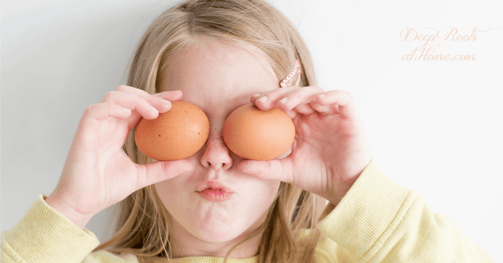 Eggs Are the Healthiest, Full-Range Nutritive Food on the Planet. A cute girl holding 2 eggs up to her eyes