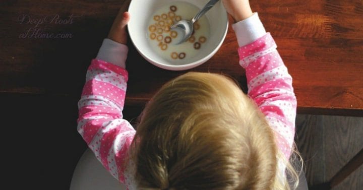 Popular Breakfast Foods With a Considerable Dose of Roundup. A pajama-clad toddler eating Cheerios.