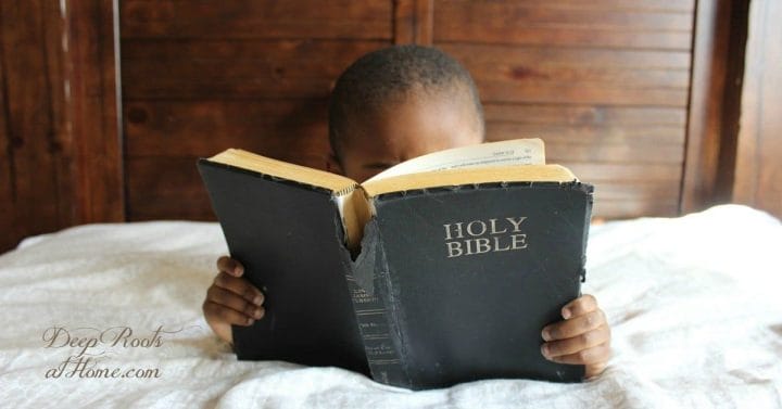 Scriptures on the Future of those who Oppose God vs. them that Trust God. A young boy reading a tattered Bible