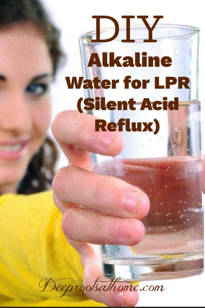 woman holding out a glass of water for acid reflux